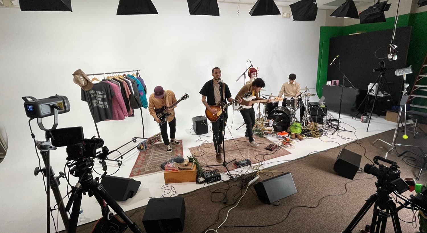A band performing on a studio set
